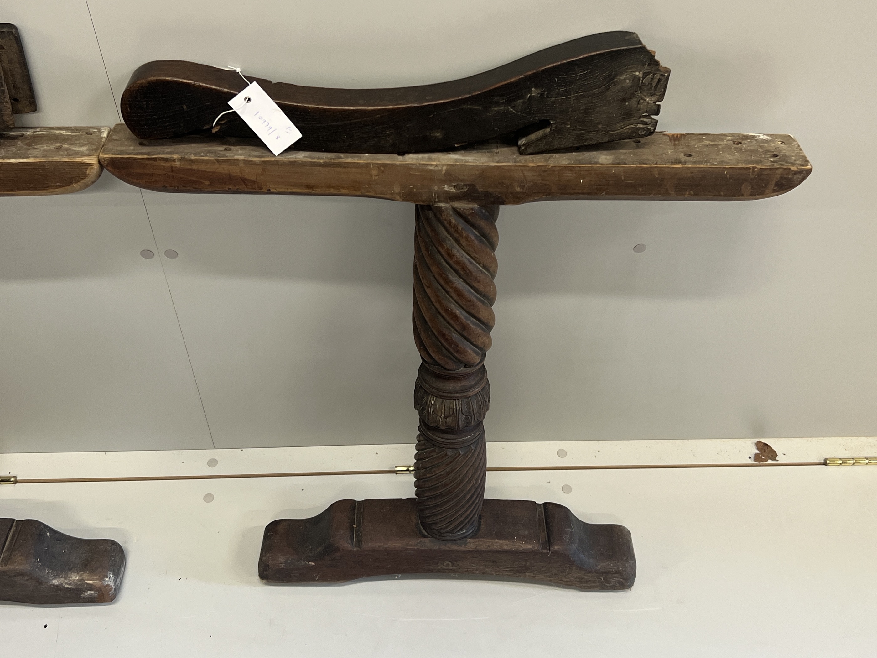 A pair of 17th century oak Wainscot chair arms together with a pair of turned walnut table supports